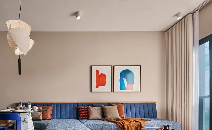 AVÉA living room with a blue sofa and timber floor, artist's impression